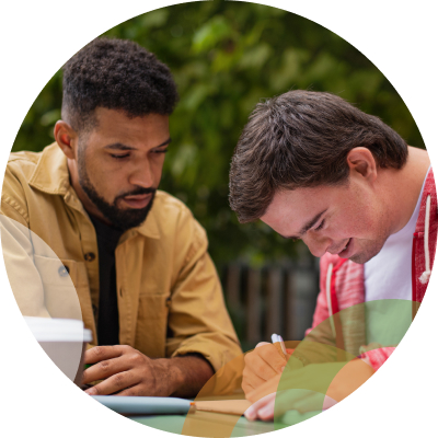 Two men sitting together at table